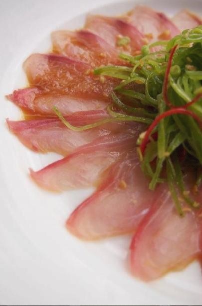 Kingfish Carpaccio with a scattered citrus
