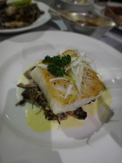 Pan-Roasted Chilean Sea Bass, Champagne Mousseline with Leek & Mushroom Ragout
