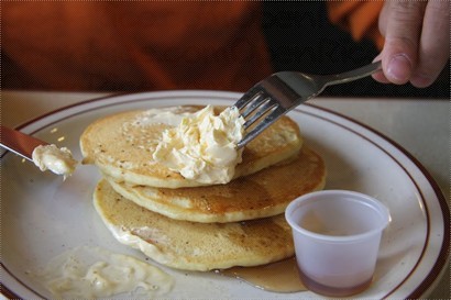 Served with maple syrup. Small stack of 3 pancakes
