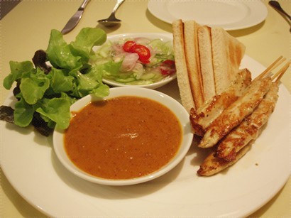 chicken satay served with peanut & cucumber sauce