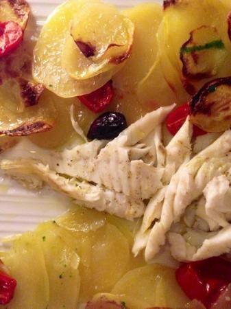 baked turbot fish with potato and tomatoes