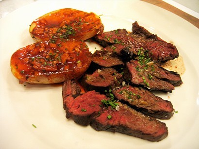 Beef Steak on the grill with Potatos and Argentinian Chimichurri Sauce